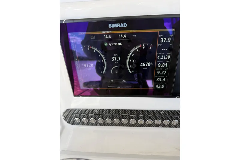 Slide: The Image of Simrad display on 2018 Calcutta catamaran showing speed, RPM, and system status. - 24