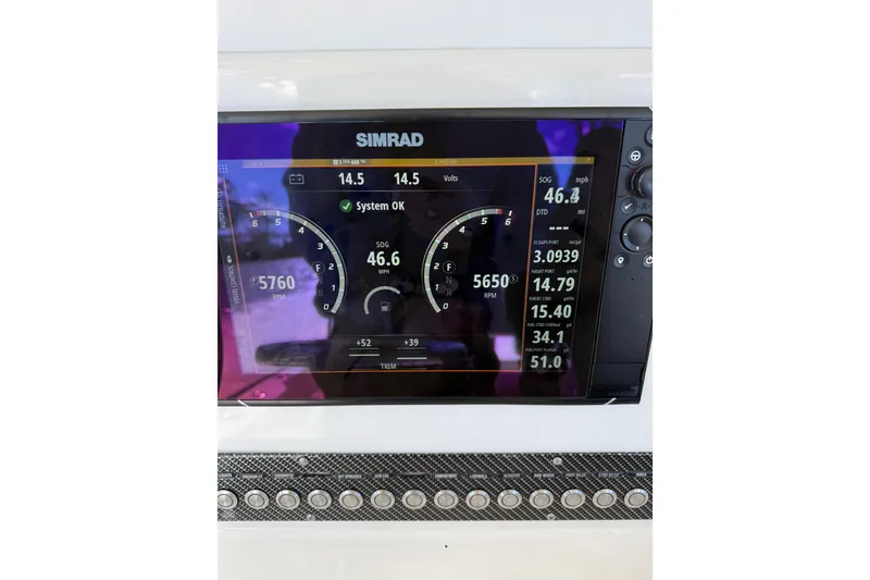 Slide: The Image of Simrad display on 2018 Calcutta catamaran showing speed, RPM, and system status. - 26