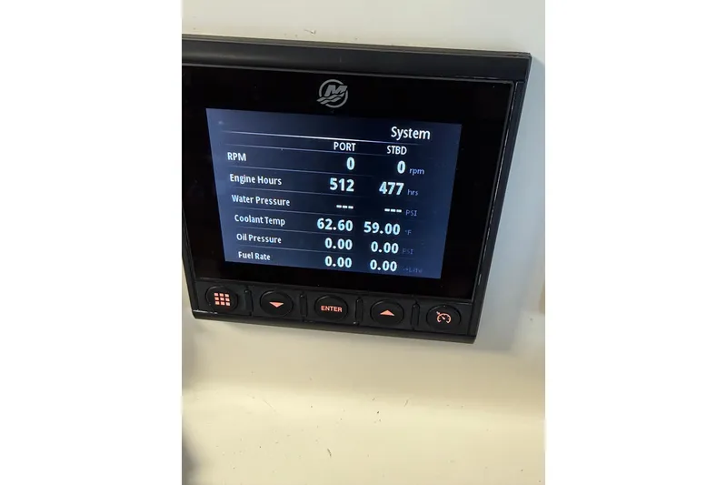 Slide: The Image of Display panel of a 2018 Calcutta catamaran showing engine hours and system metrics. - 29