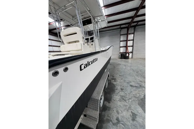 Slide: The Image of 2018 Calcutta catamaran in a warehouse, showcasing sleek design and modern features. - 3