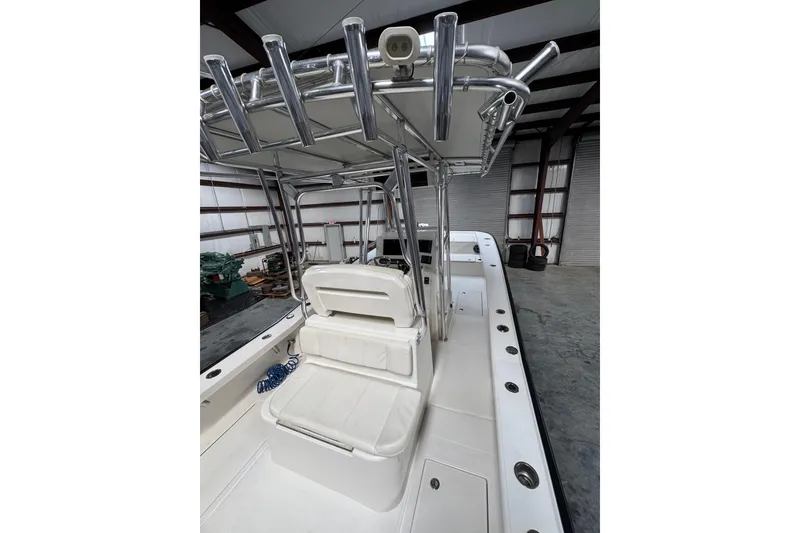 Slide: The Image of 2018 Calcutta catamaran interior with seating and metal framework in a storage facility. - 5