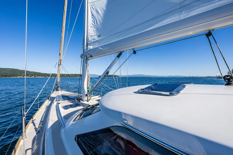 Slide: The Image of Sailing on a 2013 Ron Holland 50 yacht, clear blue skies and calm waters. - 12