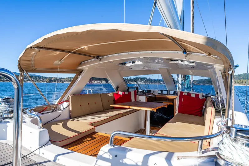 Slide: The Image of Luxurious 2013 Ron Holland 50 yacht interior with cushioned seating and ocean view. - 16