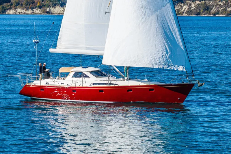 Slide: The Image of Red Ron Holland 50 sailboat from 2013 sailing on blue water. - 2