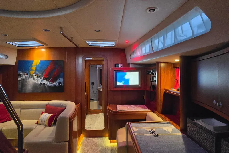 Slide: The Image of Luxurious interior of 2013 Ron Holland 50 yacht with modern decor and cozy seating. - 21