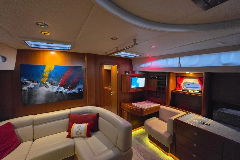 Slide: The Image of Luxurious interior of 2013 Ron Holland 50 yacht with modern furnishings and vibrant artwork. - 24
