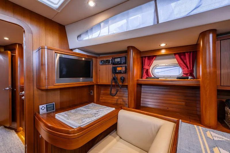 Slide: The Image of Luxurious interior of 2013 Ron Holland 50 yacht with wood finish and navigation equipment. - 25