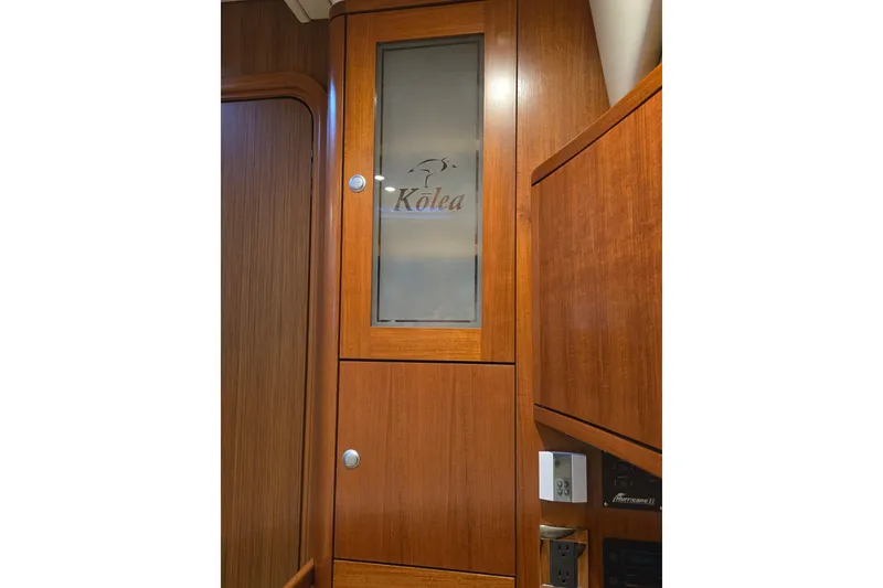 Slide: The Image of Wooden interior of 2013 Ron Holland 50 yacht with frosted glass cabinet. - 27