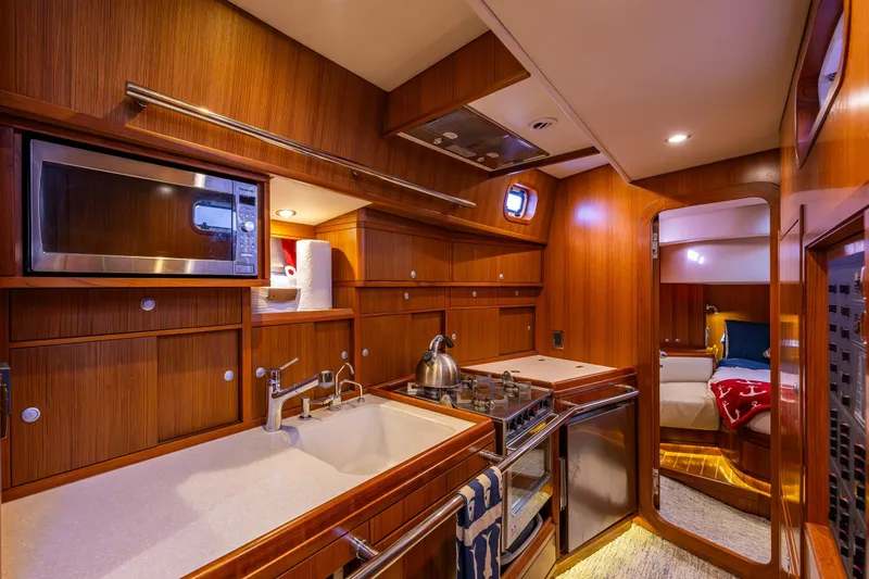 Slide: The Image of Luxurious Ron Holland 50 yacht interior kitchen with wood finish and modern amenities, 2013 model. - 30