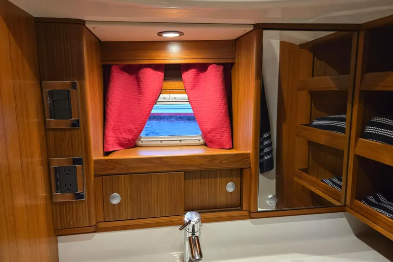 Slide: The Image of Luxurious Ron Holland 50 yacht interior with wooden cabinetry and red curtains, 2013 model. - 36