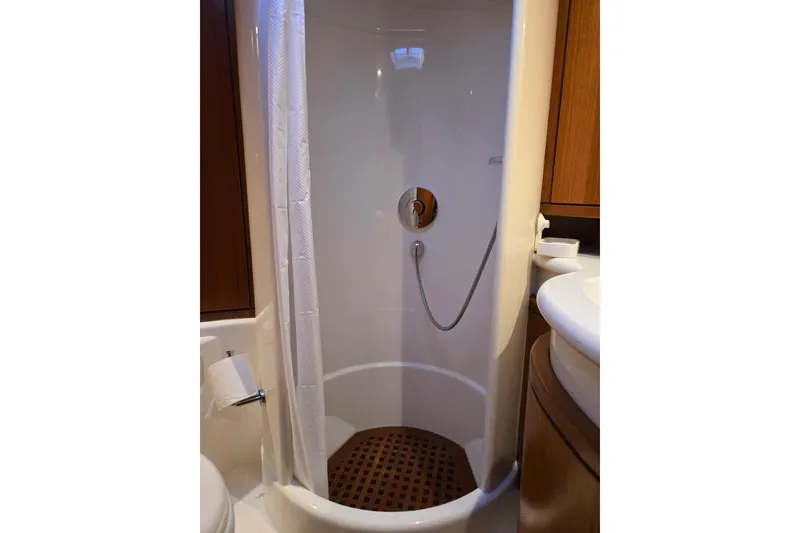 Slide: The Image of Compact shower in 2013 Ron Holland 50 yacht, featuring wooden floor and modern fixtures. - 37