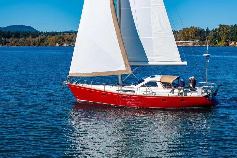 Slide: The Image of Sailing yacht Ron Holland 50, 2013 model, with red hull on blue water. - 4