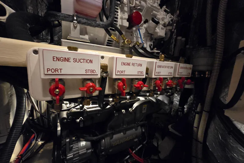 Slide: The Image of Engine room of 2013 Ron Holland 50 yacht with labeled valves and machinery. - 41