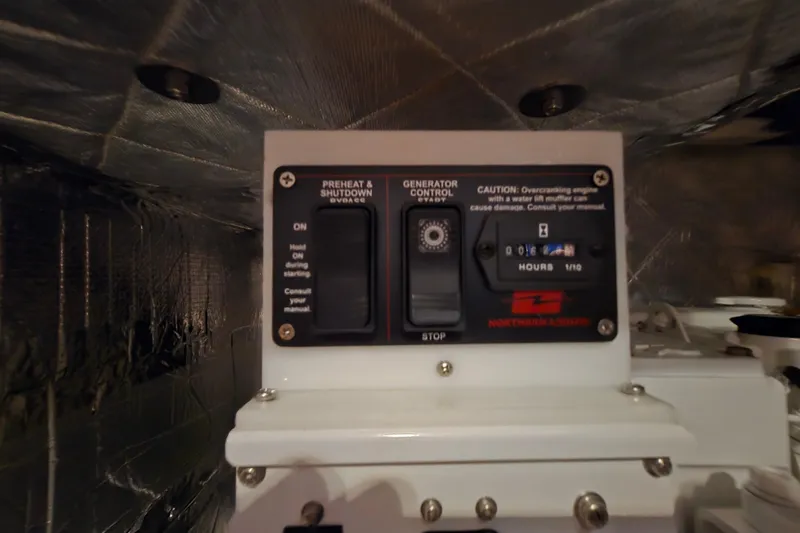 Slide: The Image of Control panel of a 2013 Ron Holland 50 generator with preheat and shutdown options. - 42