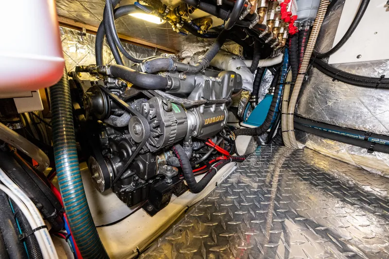Slide: The Image of Engine room of a 2013 Ron Holland 50 yacht, featuring a Yanmar engine. - 47