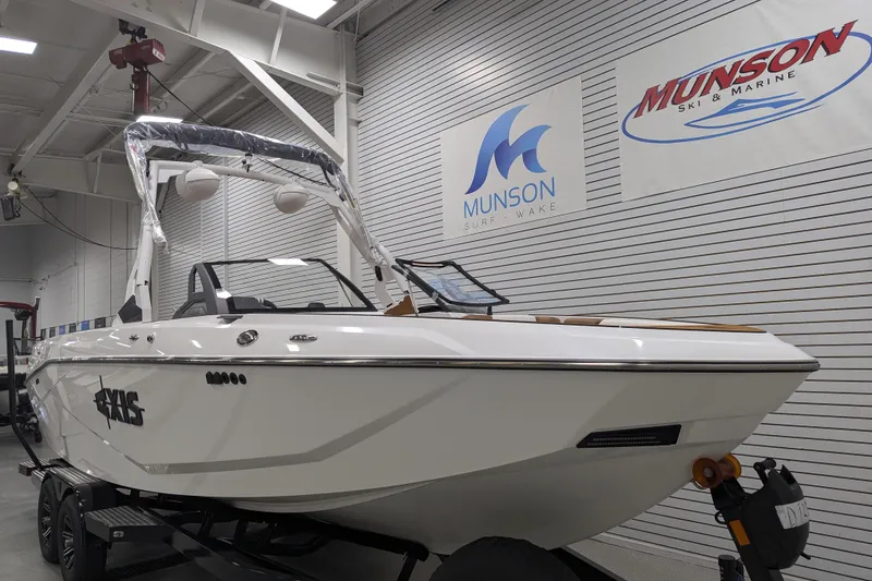 Slide: The Image of 2026 Axis T250 boat displayed at Munson Ski & Marine showroom. - 6