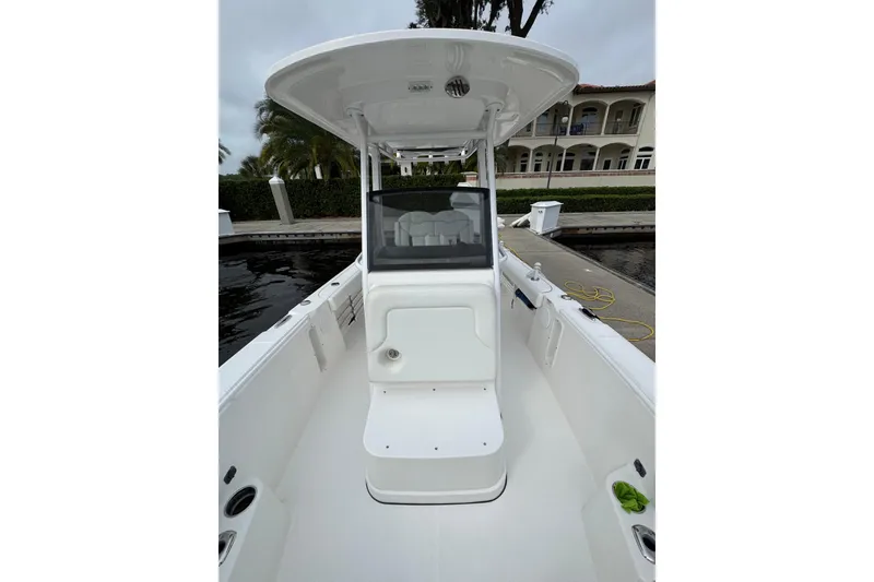 Slide: The Image of 2019 Edgewater 230CC boat interior with seating and storage compartments. - 33