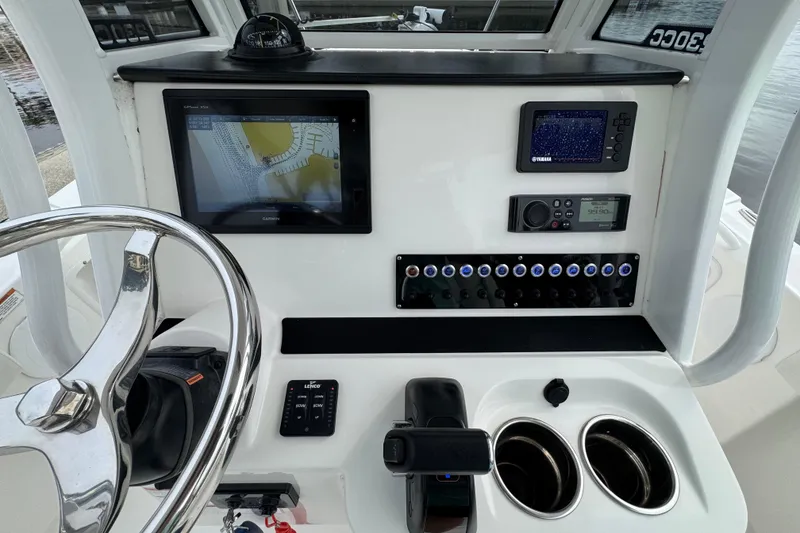Slide: The Image of 2019 Edgewater 230CC boat interior with storage, seating, and equipment. - 40
