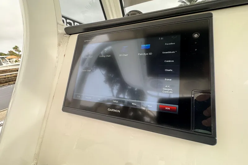 Slide: The Image of Edgewater 230CC 2019 boat dashboard with navigation and control systems. - 43