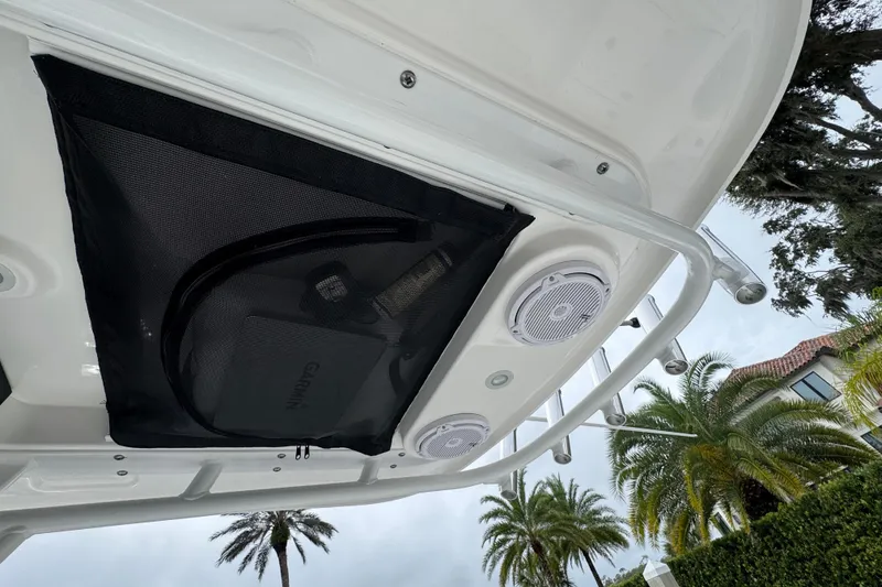 Slide: The Image of 2019 Edgewater 230CC boat console with steering wheel, controls, and navigation display. - 50