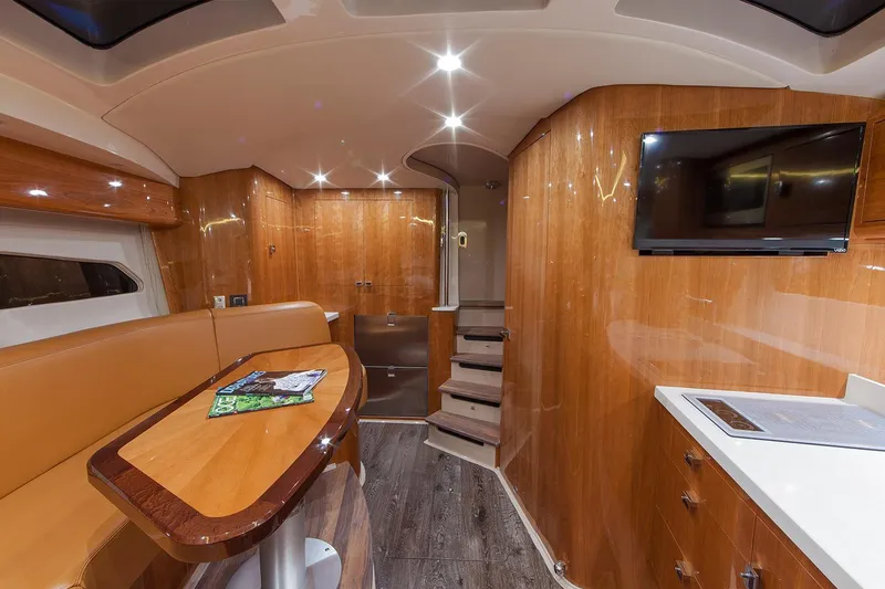 Slide: The Image of Manufacturer Provided Image: Luxurious interior of 2021 Intrepid 410 Evolution yacht with wood finishes and modern amenities. - 11