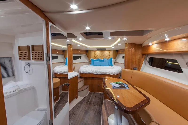 Slide: The Image of Manufacturer Provided Image: Luxurious interior of 2021 Intrepid 410 Evolution yacht with cozy bedroom and elegant seating area. - 12