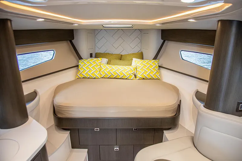 Slide: The Image of Manufacturer Provided Image: Luxurious cabin interior of 2021 Intrepid 410 Evolution yacht with cozy bed and modern design. - 16