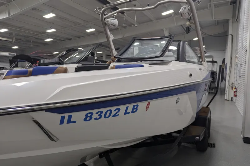 Slide: The Image of 2021 Malibu Wakesetter 22 LSV boat in showroom, side view with registration number. - 13