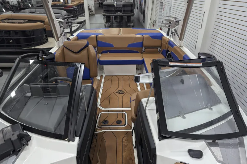 Slide: The Image of 2021 Malibu Wakesetter 22 LSV interior with tan and blue seating, sleek design. - 21