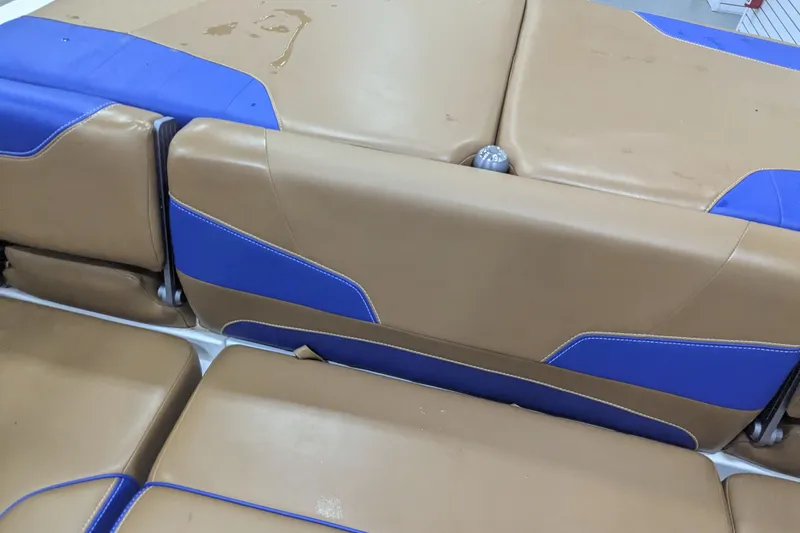 Slide: The Image of 2021 Malibu Wakesetter 22 LSV interior with tan and blue upholstery. - 27