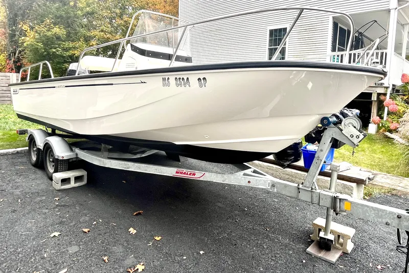 Slide: The Image of 2020 Boston Whaler 210 Montauk boat interior with steering console and seating. - 15
