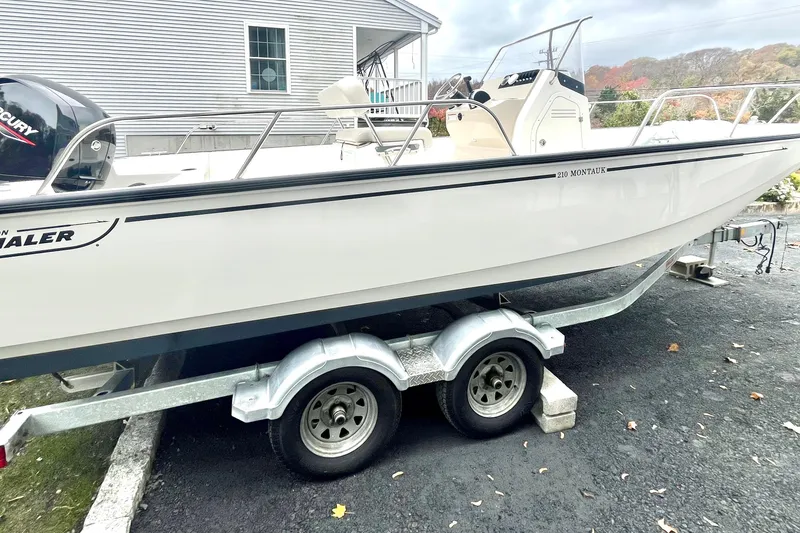 Slide: The Image of 2020 Boston Whaler 210 Montauk boat interior with steering console and seating. - 17