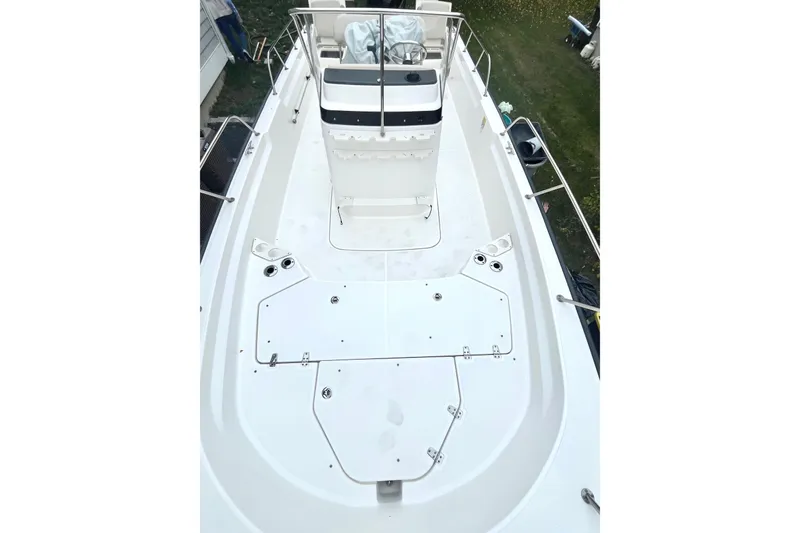 Slide: The Image of Bilge pump in 2020 Boston Whaler 210 Montauk boat, with wiring and debris. - 26