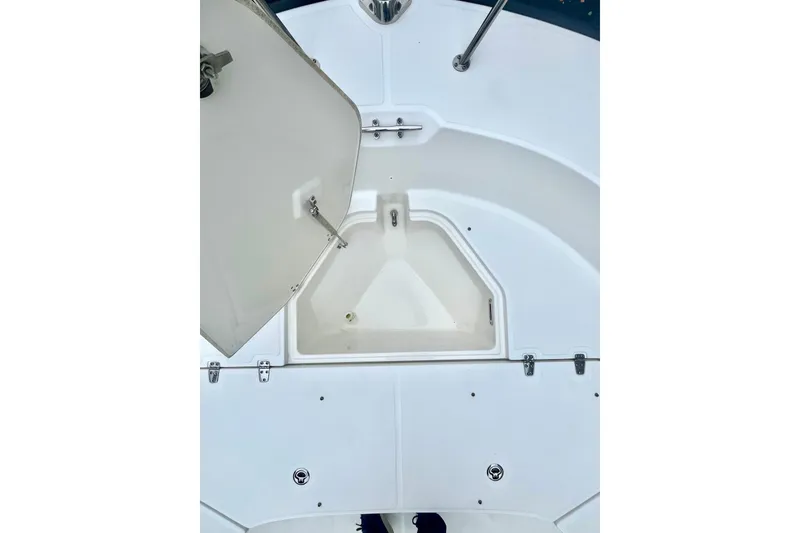 Slide: The Image of 2020 Boston Whaler 210 Montauk boat console with windshield and rod holders. - 29