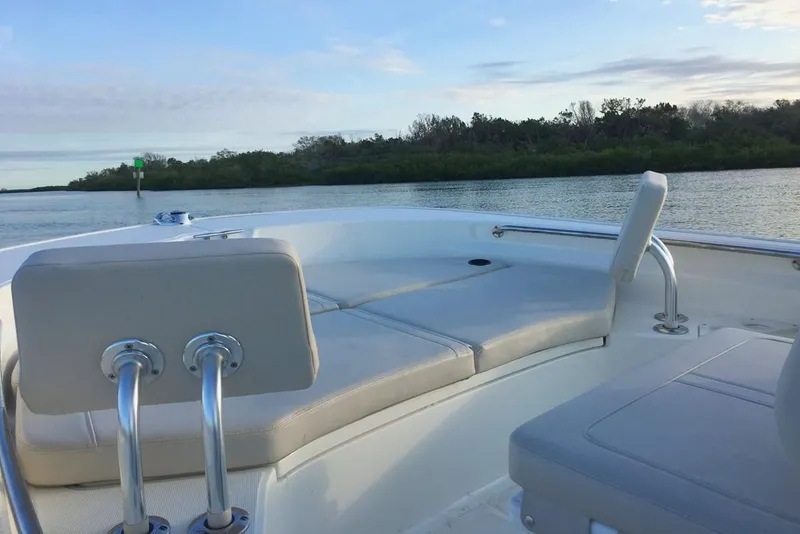 Slide: The Image of 2020 Boston Whaler 210 Montauk boat on trailer, parked near a house. - 3