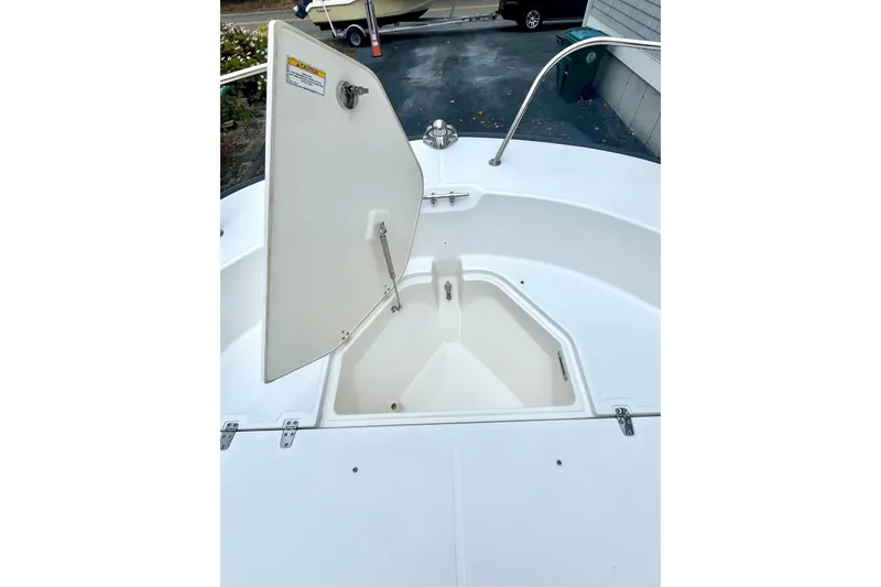 Slide: The Image of 2020 Boston Whaler 210 Montauk boat interior with white deck and railing. - 30