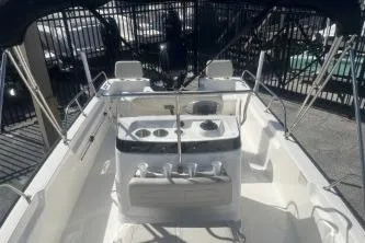 Slide: The Image of 2024 Boston Whaler 190 Montauk boat interior with console and seating. - 9
