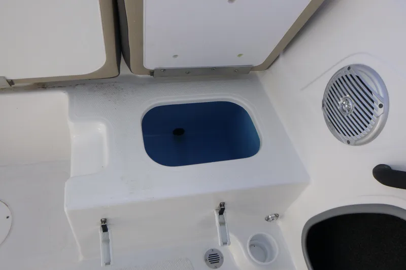 Slide: The Image of 2024 Tahoe 185 S boat interior with storage compartment and speaker. - 10