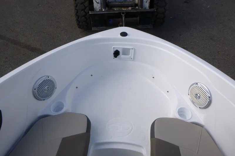 Slide: The Image of 2024 Tahoe 185 S boat interior with speakers and seating, viewed from above. - 21