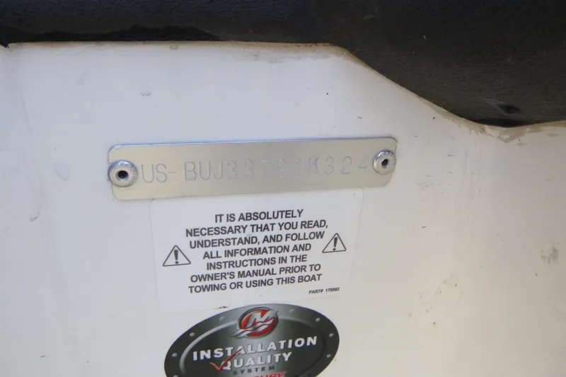 Slide: The Image of 2024 Tahoe 185 S boat identification plate with safety instructions and installation quality sticker. - 27