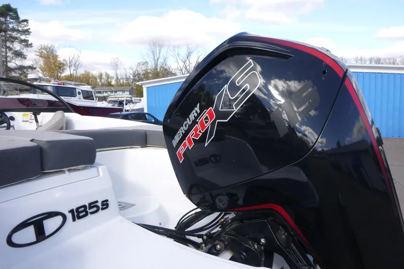 Slide: The Image of 2024 Tahoe 185 S boat with Mercury Pro XS engine, docked outdoors. - 3