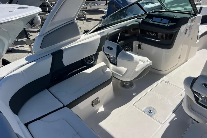 Slide: The Image of 2023 Chaparral 270 OSX boat interior with seating and helm station. - 11