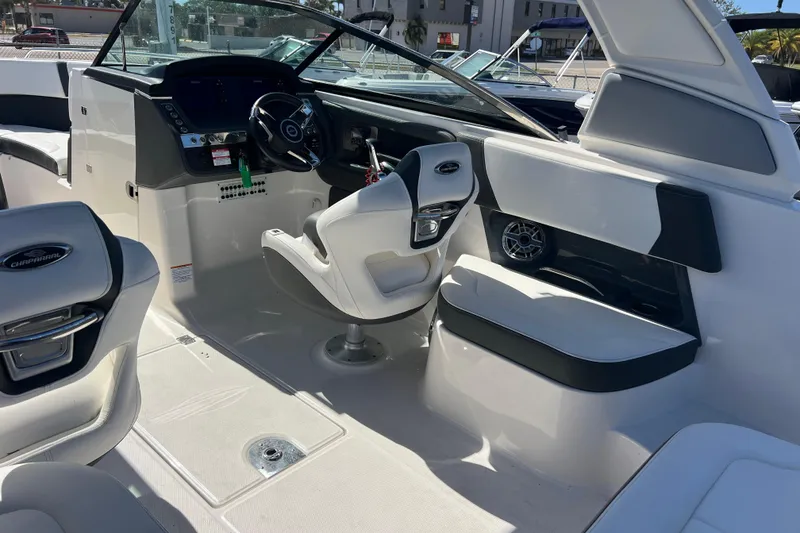 Slide: The Image of 2023 Chaparral 270 OSX boat interior with modern helm and seating. - 12