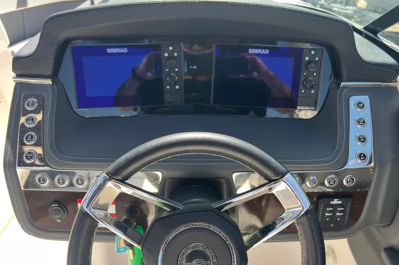 Slide: The Image of Dashboard of 2023 Chaparral 270 OSX boat with dual Simrad displays. - 15