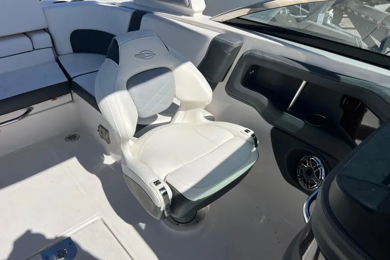 Slide: The Image of 2023 Chaparral 270 OSX boat interior with white seating and modern design. - 22