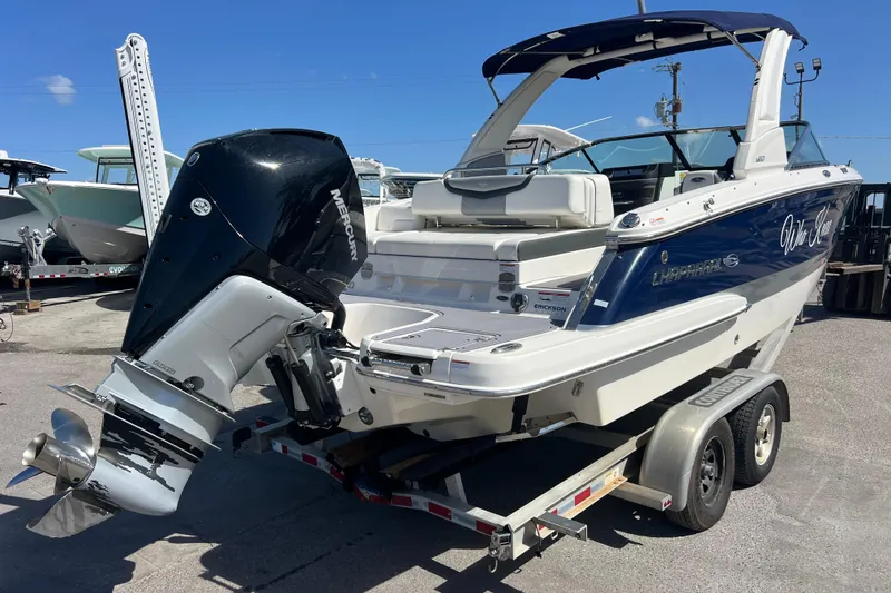 Slide: The Image of 2023 Chaparral 270 OSX boat on trailer with Mercury outboard engine. - 3