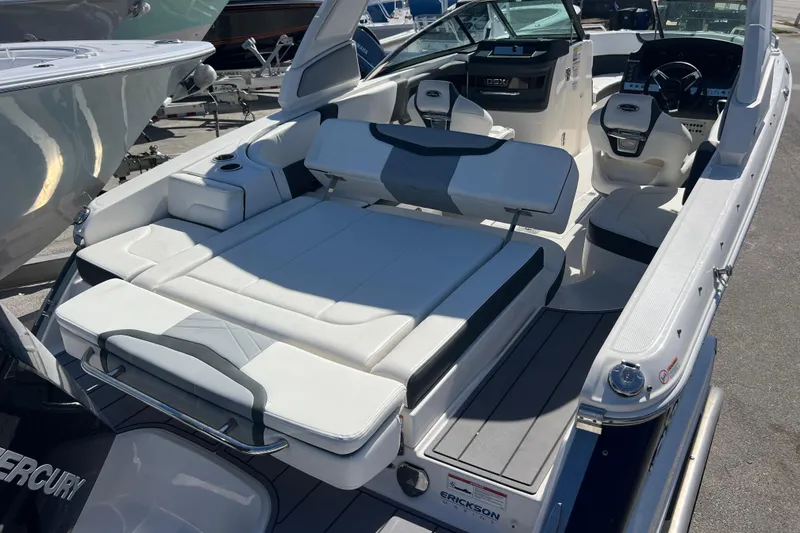 Slide: The Image of 2023 Chaparral 270 OSX boat interior with luxurious seating and modern dashboard. - 7