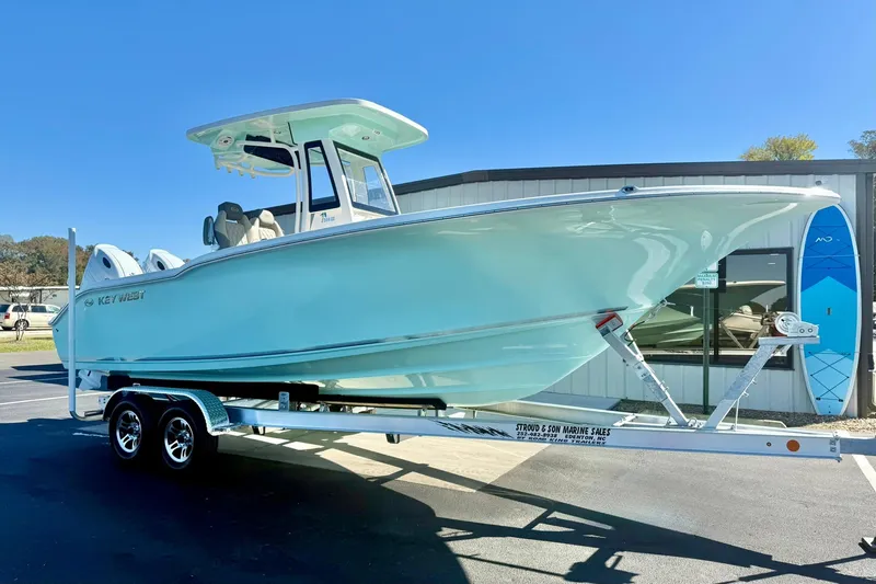The Image of 2026 Key West 244 Center Console boat on trailer, displayed outdoors. - 1