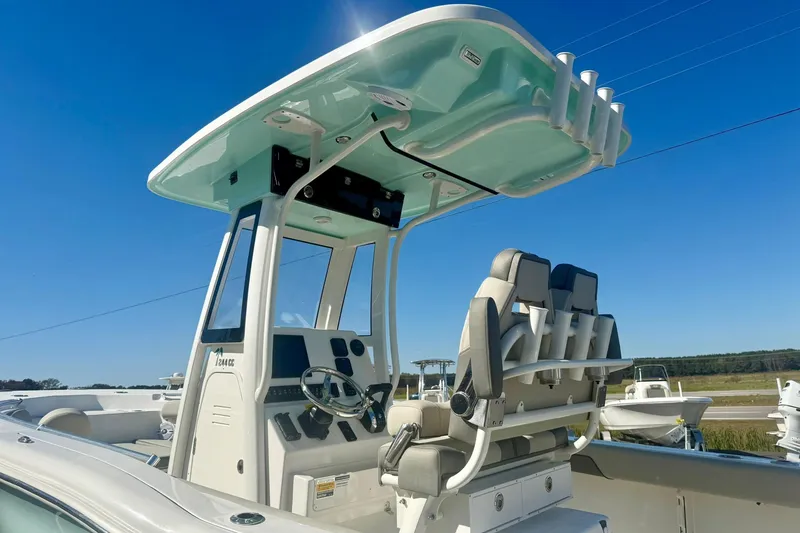 Slide: The Image of 2026 Key West 244 Center Console boat on trailer outside marine dealership. - 10