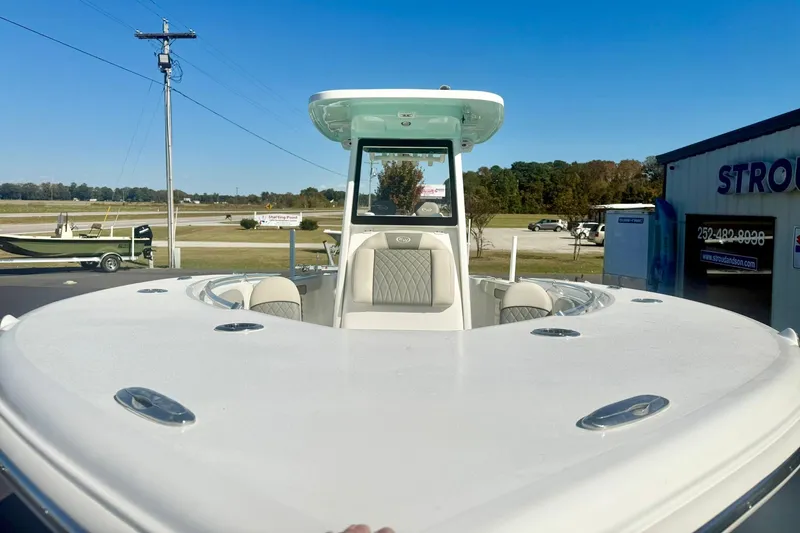 Slide: The Image of 2026 Key West 244 Center Console boat hull on trailer, close-up view. - 12